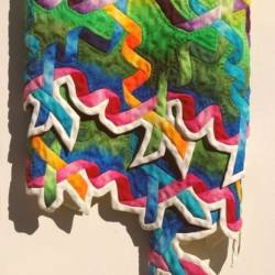 Close up view of the Fat Tuesday Quilt Wood Carving by Fraser Smith