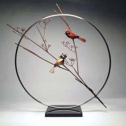 A metal sculpture of a pair of Cardinals by Don Rambadt A metal sculpture of a pair of Cardinals by Don Rambadt